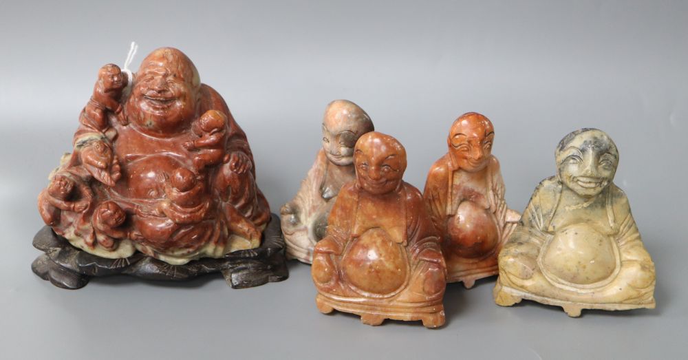 A hardstone Buddha on stand and four others, tallest 10cm